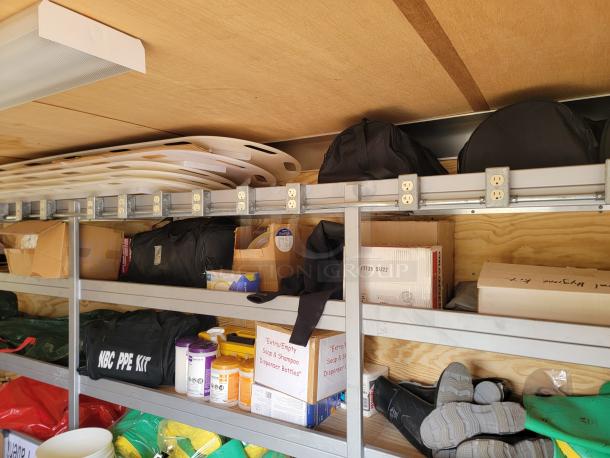 24' Continental Cargo Enclosed Tandem Axle Trailer! Comes with spare tire.*CONTENTS NOT INCLUDED* Equipped with overhead lighting, wood paneling interior, shelving, and electrical outlets! - This item is off site in Biddeford. - Image 10 of 15