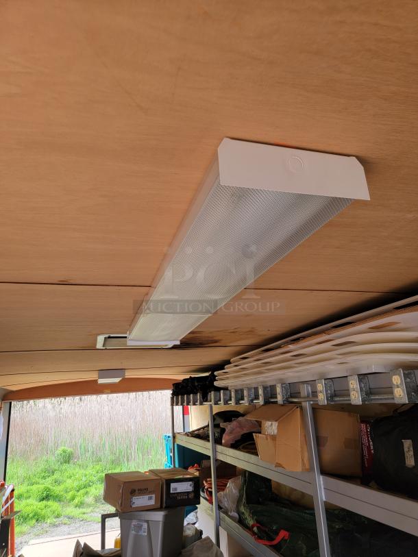 24' Continental Cargo Enclosed Tandem Axle Trailer! Comes with spare tire.*CONTENTS NOT INCLUDED* Equipped with overhead lighting, wood paneling interior, shelving, and electrical outlets! - This item is off site in Biddeford. - Image 12 of 15