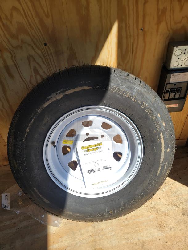 24' Continental Cargo Enclosed Tandem Axle Trailer! Comes with spare tire.*CONTENTS NOT INCLUDED* Equipped with overhead lighting, wood paneling interior, shelving, and electrical outlets! - This item is off site in Biddeford. - Image 9 of 15