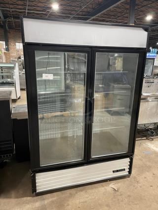 True Commercial White Powder Coated Double Glass Sliding Door Reach In Merchandiser Freezer! With Adjustable Poly Coated Wire Racks! Model: GDM-49F SN: 4954769! 115/208-230V 1 Phase!