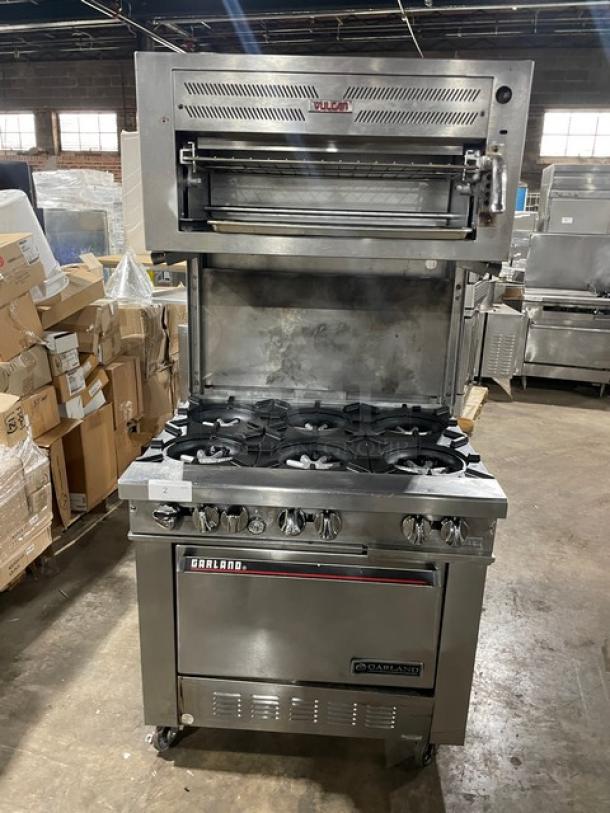 Garland Commercial Stainless Steel Natural Gas Powered 6 Burner Range/Oven Combo! With Vulcan Commercial Stainless Steel Overhead Salamander Broiler/Cheese Melter! With Wired Oven Racks! On Casters! - Image 1 of 9