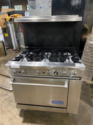 Imperial Commercial Stainless Steel Natural Gas Powered 6 Burner Range/Oven Combo! With Back Splash & Overhead Salamander Shelf! With Wired Oven Rack! On Legs!
