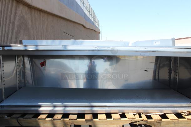 BRAND NEW SCRATCH-N-DENT! Regency 600EBTB3096D 30" x 96" 16 Gauge Type 304 Stainless Steel Enclosed Base Sliding Door Table with Adjustable Midshelf and 6" Backsplash. Unit is Dented. - Image 1 of 5