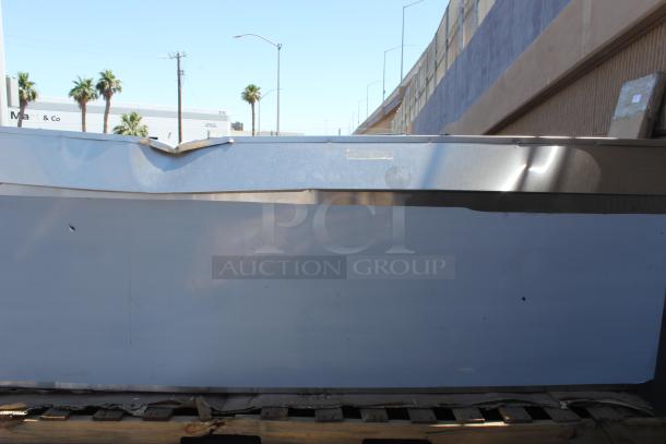 BRAND NEW SCRATCH-N-DENT! Regency 600EBTB3096D 30" x 96" 16 Gauge Type 304 Stainless Steel Enclosed Base Sliding Door Table with Adjustable Midshelf and 6" Backsplash. Unit is Dented. - Image 4 of 5