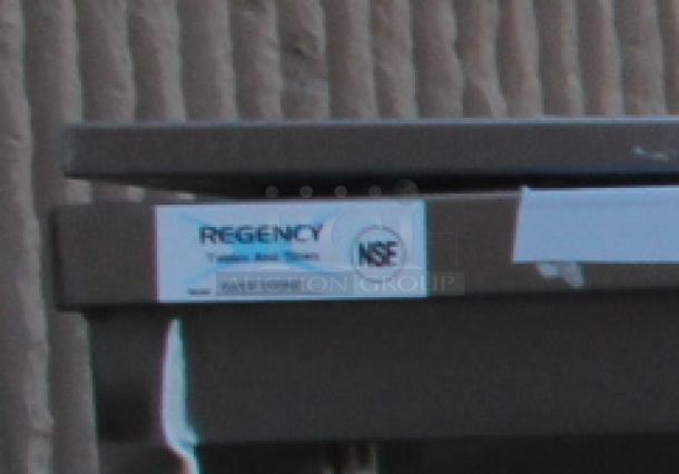 BRAND NEW SCRATCH-N-DENT! Regency 600EBTB3096D 30" x 96" 16 Gauge Type 304 Stainless Steel Enclosed Base Sliding Door Table with Adjustable Midshelf and 6" Backsplash. Unit is Dented. - Image 5 of 5