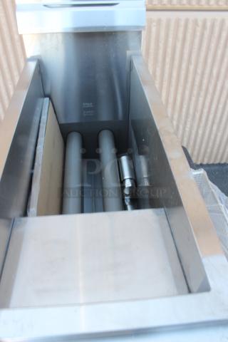 BRAND NEW SCRATCH-N-DENT! Cooking Performance Group FCPG15 Natural Gas 15 lb. Countertop Fryer - 26,500 BTU. Serial # 23110 0 8 0 2 8 Unit is damaged.