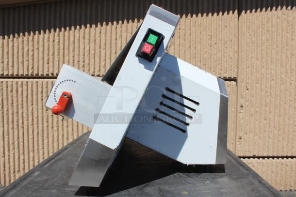 Industrial stainless steel tilting mechanism with red lever, on/off switch, and ventilation slits. Good condition.