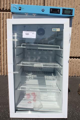 Laboratory refrigerator with blue control panel, glass door, and multiple shelves. Markings show "EQ Temp." Good condition.