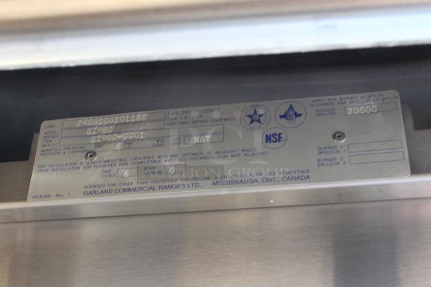 Garland Commercial Ranges label showing model GIR60, gas type NAT, 20,000 BTU, intended for non-household use, Mississauga, Canada.