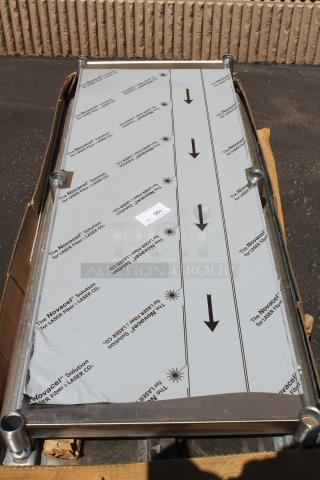 Rectangular metal panel branded "Novacel" for LASER Co., with protective covering, in excellent condition, boxed.