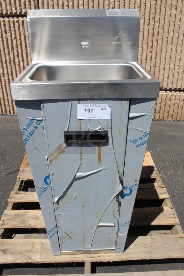 Stainless steel commercial sink by Advance Tabco, mounted on a wooden pallet, protective film partially intact, auction tag with lot 107.