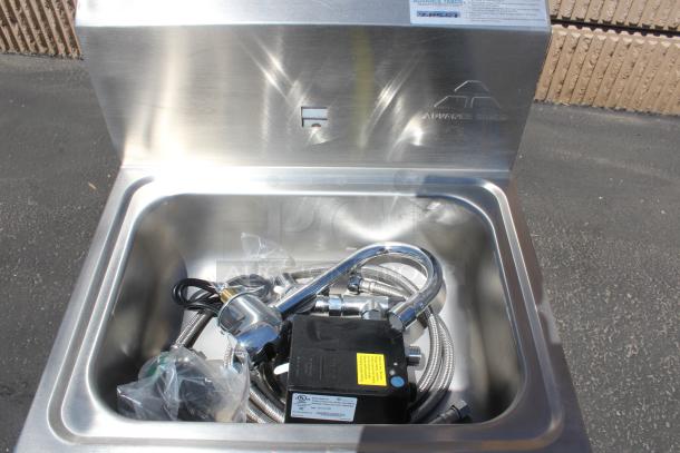 Stainless steel hand sink by Advance Tabco, new condition, with faucet assembly and hoses included.