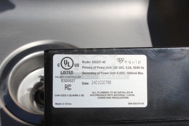 Faucet controller, Model 020237-45 by T&S Equip, UL listed. Primary: 120VAC, 0.2A. Secondary: 6VDC, 1000mA. Made in China.