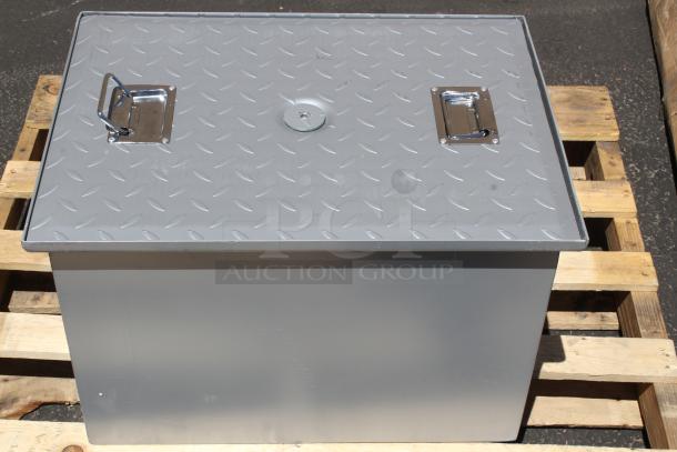 Steel storage box with diamond plate lid, dual chrome handles, protective lock, excellent condition, mounted on a pallet.