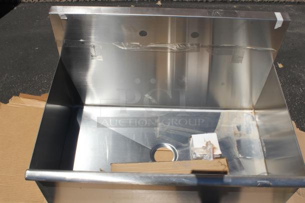 Stainless steel utility sink, new condition, featuring heavy-duty construction, a single faucet hole, and protective film.
