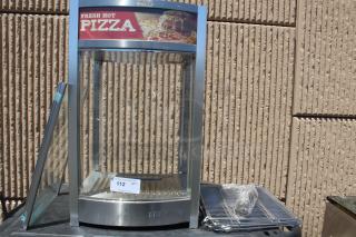 Commercial pizza warmer with stainless steel frame and glass sides, featuring "Fresh Hot Pizza" sign. Includes racks and accessories. Condition: used.