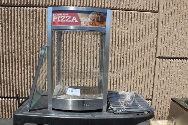 Pizza display warmer with glass door, stainless steel frame, marked "Fresh Hot Pizza." Includes racks and cables. Auction lot 112.