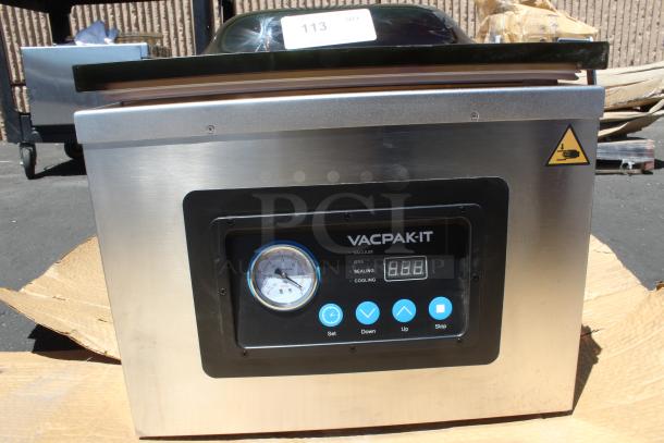 VacPak-It vacuum sealer with stainless steel body, gauge, digital display, and control buttons. Appears in good condition.