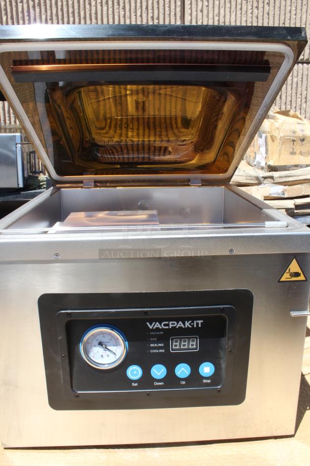VACPAK-IT vacuum sealer with digital display and control panel. Stainless steel, lightly used, open lid showing interior.