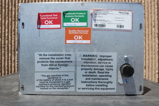 Metal appliance panel with functional and quality review labels marked "OK". Serial and model numbers visible. Includes installation and warning instructions.