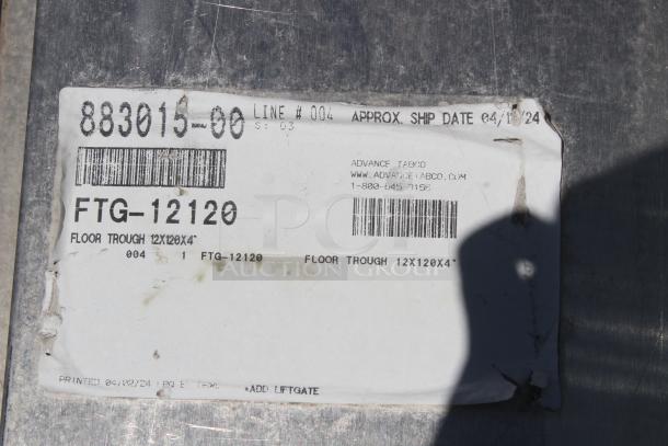 Label on metal floor trough FTG-12120, dimensions 12"x120"x4". Contains barcodes, part number, and seller info.