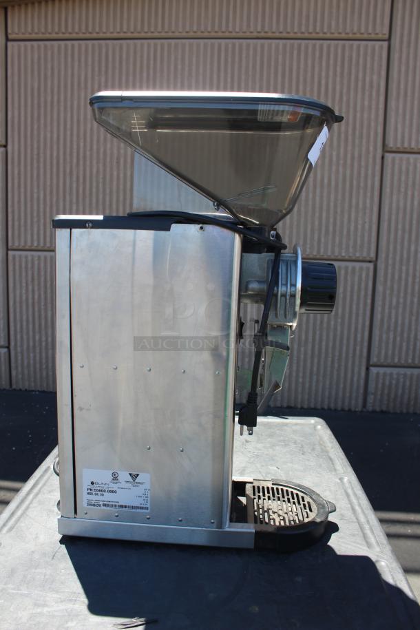 Commercial coffee grinder, metal body, side view showing large hopper and power cord. Visible label with specs indicates model PH-S5000.0000.