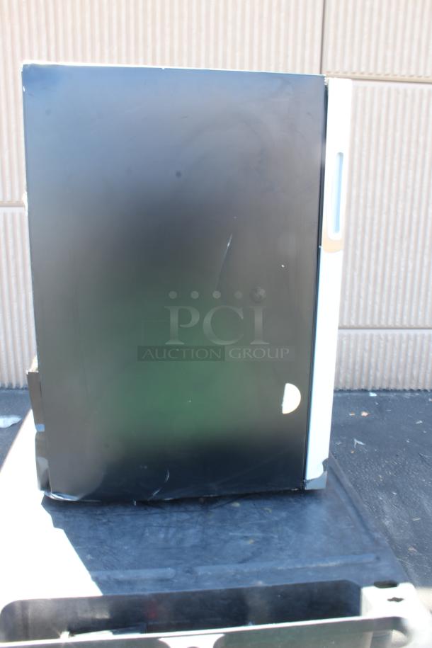Black metal cabinet with white trim, minor scratches, and handle on the side. Suitable for storage or office use.