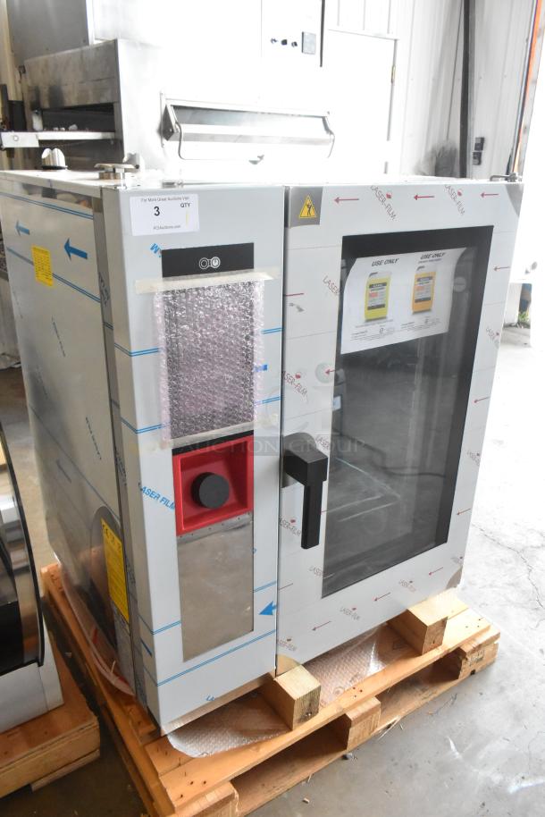Brand new Blodgett AETG101R stainless steel combi convection oven with protective film, visible labels, and minor dents.
