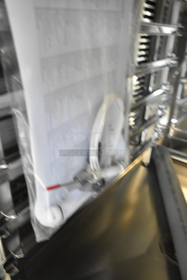 Brand new Blodgett AETG101R stainless steel natural gas combi convection oven, scratch and dent condition, factory tags visible.