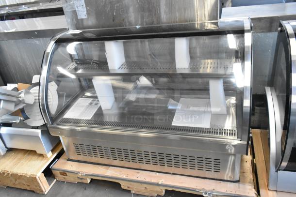 Brand new Vollrath RDE7148 stainless steel refrigerated display case, 120 volts, with minor scratches and dents.