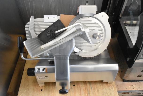 Brand new Globe SG13A-07 stainless steel meat slicer with blade sharpener. 220V, 1 phase, slight scratches.