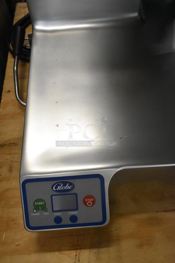 Brand new Globe SG13A-07 stainless steel meat slicer, 2018 model, with blade sharpener, 220V, minor surface dents.