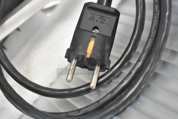 Close-up of the power plug and cable of a Globe SG13A-07 meat slicer, indicating 220V, 1 phase.
