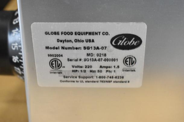 BRAND NEW Globe SG13A-07 stainless steel meat slicer, 220V, 1 Phase. Includes blade sharpener. Serial: SG13A-07-000001.