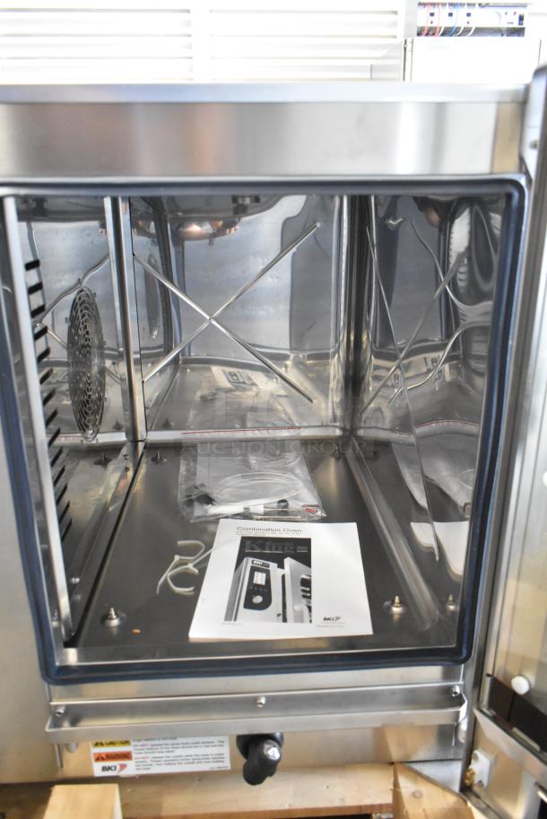Bakers Pride AEHE061R stainless steel combi convection oven, 208V, 3-phase. Brand new with tags; some cosmetic dents.