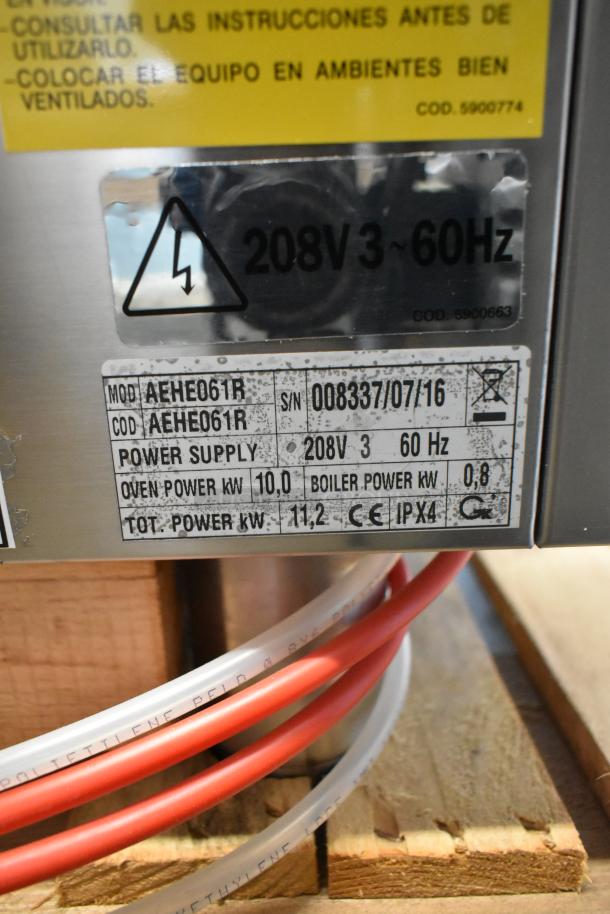 Stainless steel label on Bakers Pride AEHE061R commercial oven, showing 208V, 3-phase, 60Hz, 11.2 kW power.