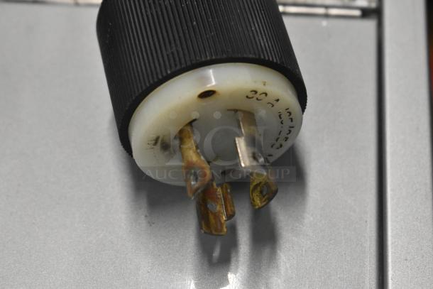 Close-up of plug from Necta Kolbalto Metal Commercial Espresso Machine, showing wear. 30A, 125/250V markings visible.