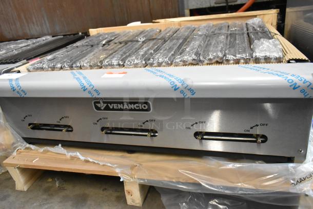 Brand new, scratch and dent Venancio CGG36 stainless steel countertop natural gas charbroiler grill with control knobs.
