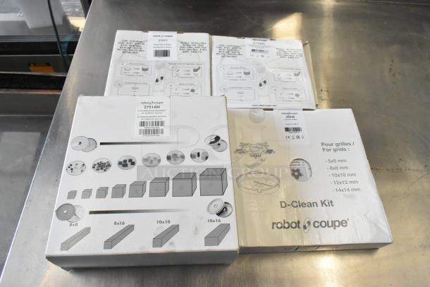 Robot Coupe R402 food processor parts; boxes for 27577 grating, 27566 slicing discs, 27114W dicing, 29246 cleaning kit.