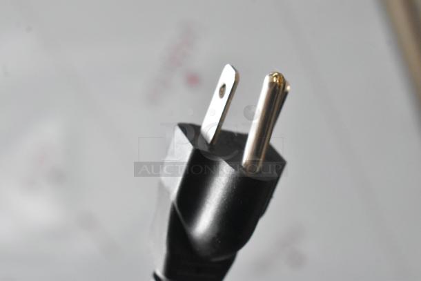 Close-up of a power plug from the Robot Coupe R402 food processor. New condition, scratch and dent item, 120V, 1 phase.