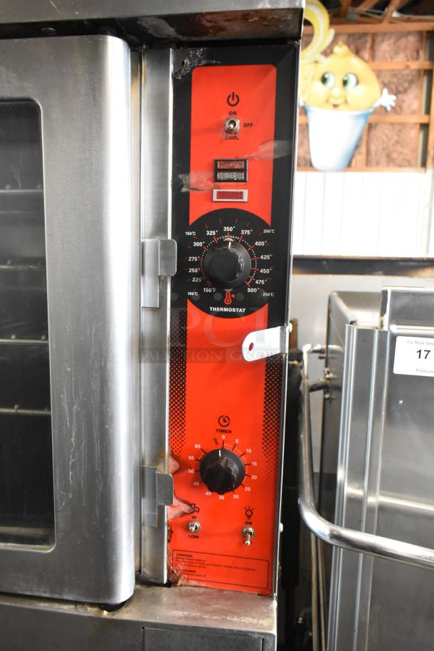 Vulcan VC4CD stainless steel convection oven with view-through doors, thermostatic controls, and metal racks on casters.