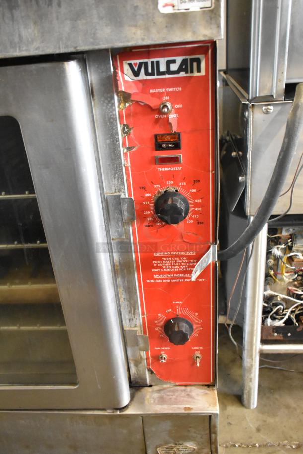 2 Vulcan VC4CD stainless steel convection ovens with view-through doors, thermostatic controls, and metal racks on casters.