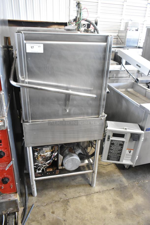 Stainless steel commercial corner pass-through dishwasher in good condition with visible operating controls and wiring. Model number obscured.
