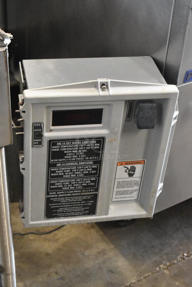Stainless steel commercial corner pass through dishwasher with control panel. Features manual and auto modes, sanitization settings, and warning labels visible.