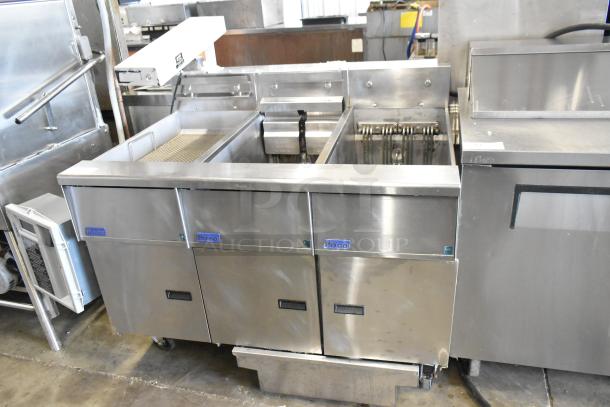 2019 Pitco Frialator SE14 stainless steel commercial electric 2 bay fryer with SEBNB14 dumping station, Hatco warming strip, and filtration system on casters.
