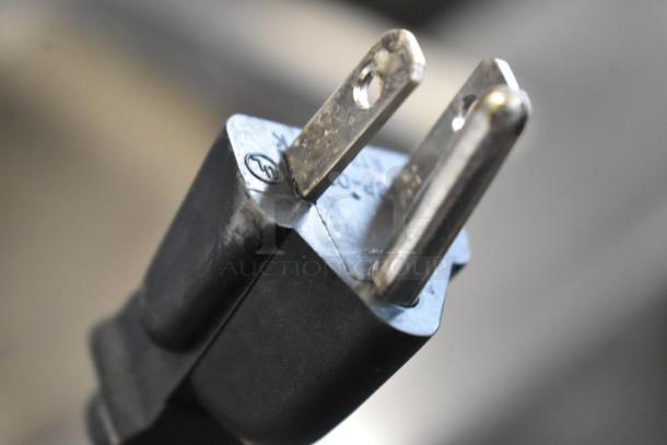Close-up of the plug for a 2019 Pitco Frialator SE14 electric fryer, showing prongs and partial certification mark.