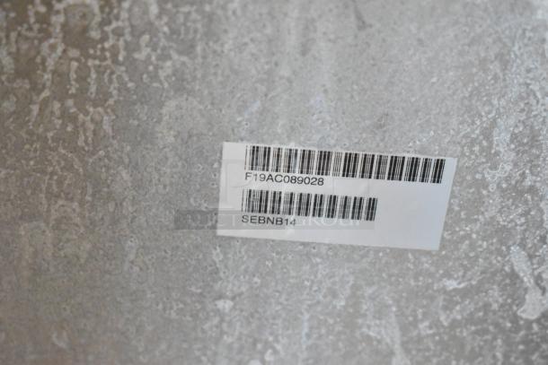 Label with barcode and text "F19AC089028" and "SEBNB14" on a metal surface of the 2019 Pitco Frialator SE14 fryer.
