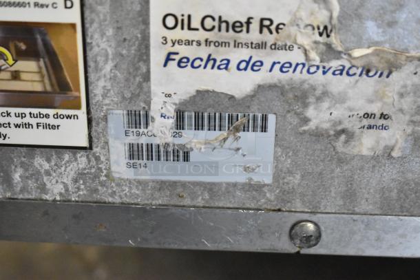 2019 Pitco Frialator SE14 stainless steel electric 2-bay fryer with SEBNB14 dumping station. Includes Hatco warming strip, filtration system, on casters. Model SE14 visible on worn label.