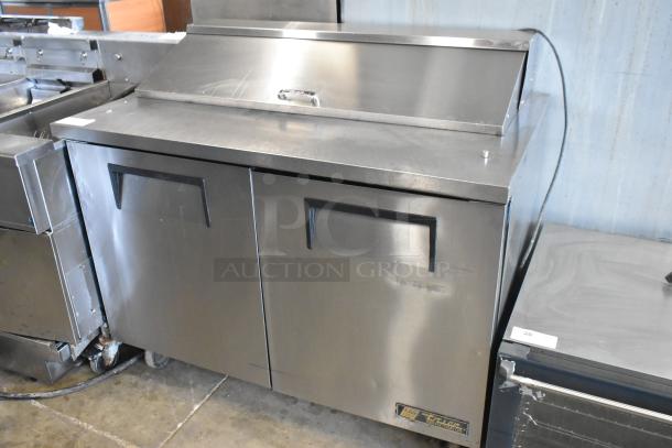 True TSSU-48-12 stainless steel sandwich prep table with mega top, commercial casters, 115V, 1 phase.
