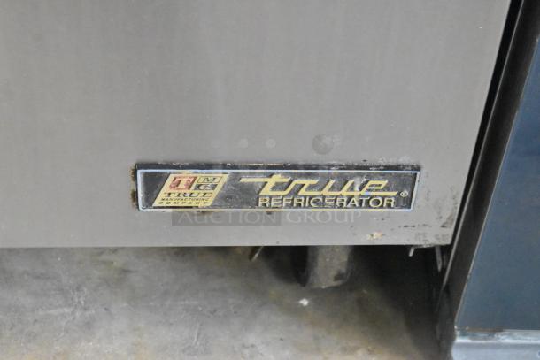True TSSU-48-12 stainless steel prep table, visible brand logo, commercial casters. 115V, 1 phase, used condition.